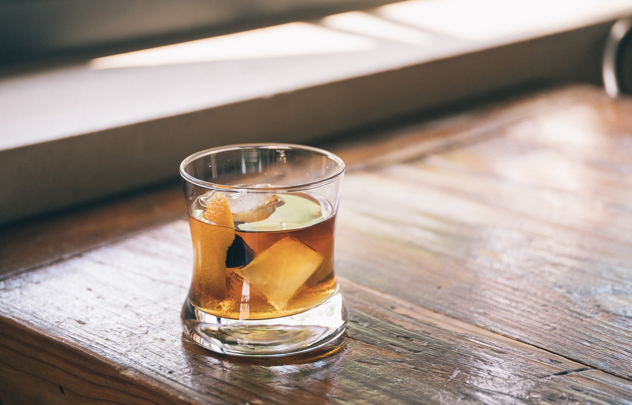 Old fashioned cocktail on wood table